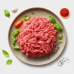 "Ground beef nutrition plate showing cooked lean beef with labels for protein, fat, iron, and vitamin B12"